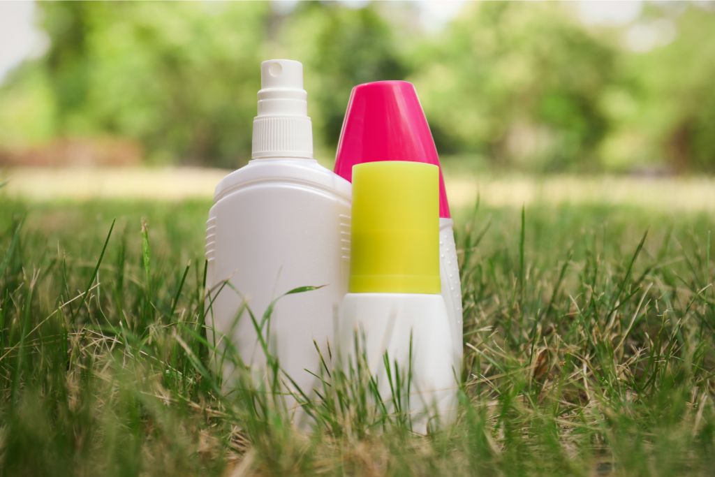 bottles of chemical repellant on the grass
